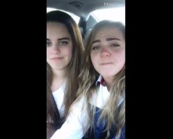 Beautiful girls kissing in the car